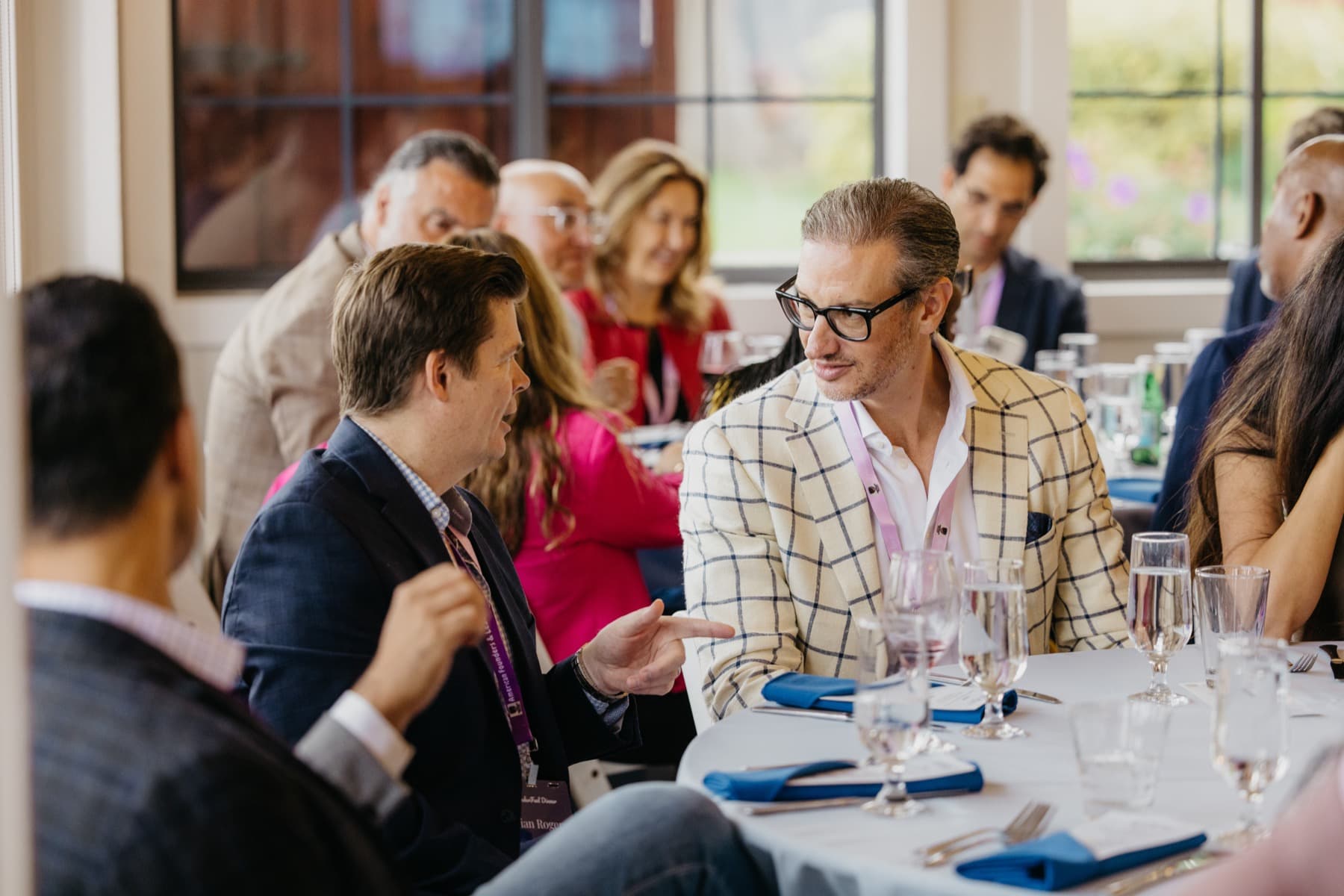 Aureum members in conversation at a private dinner
