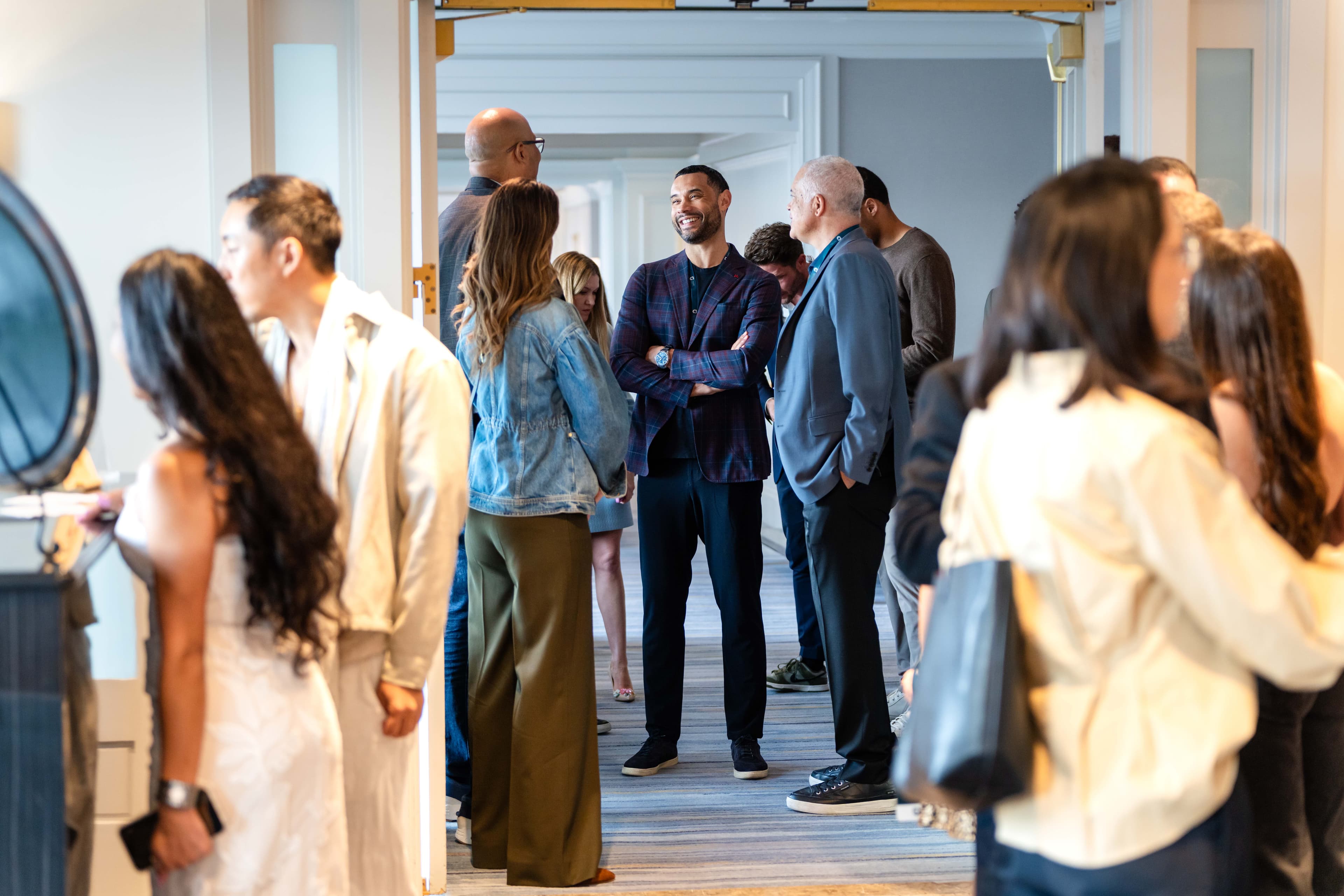 Aureum members in vibrant conversation at a flagship gathering